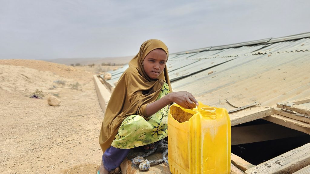 girl getting water